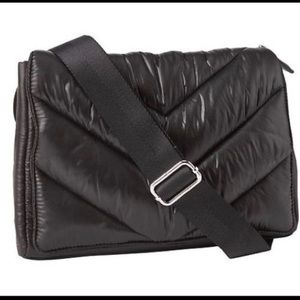 Caraa x ATHLETA black quilted crossbody bag.